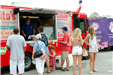 family standing in line at a food truck