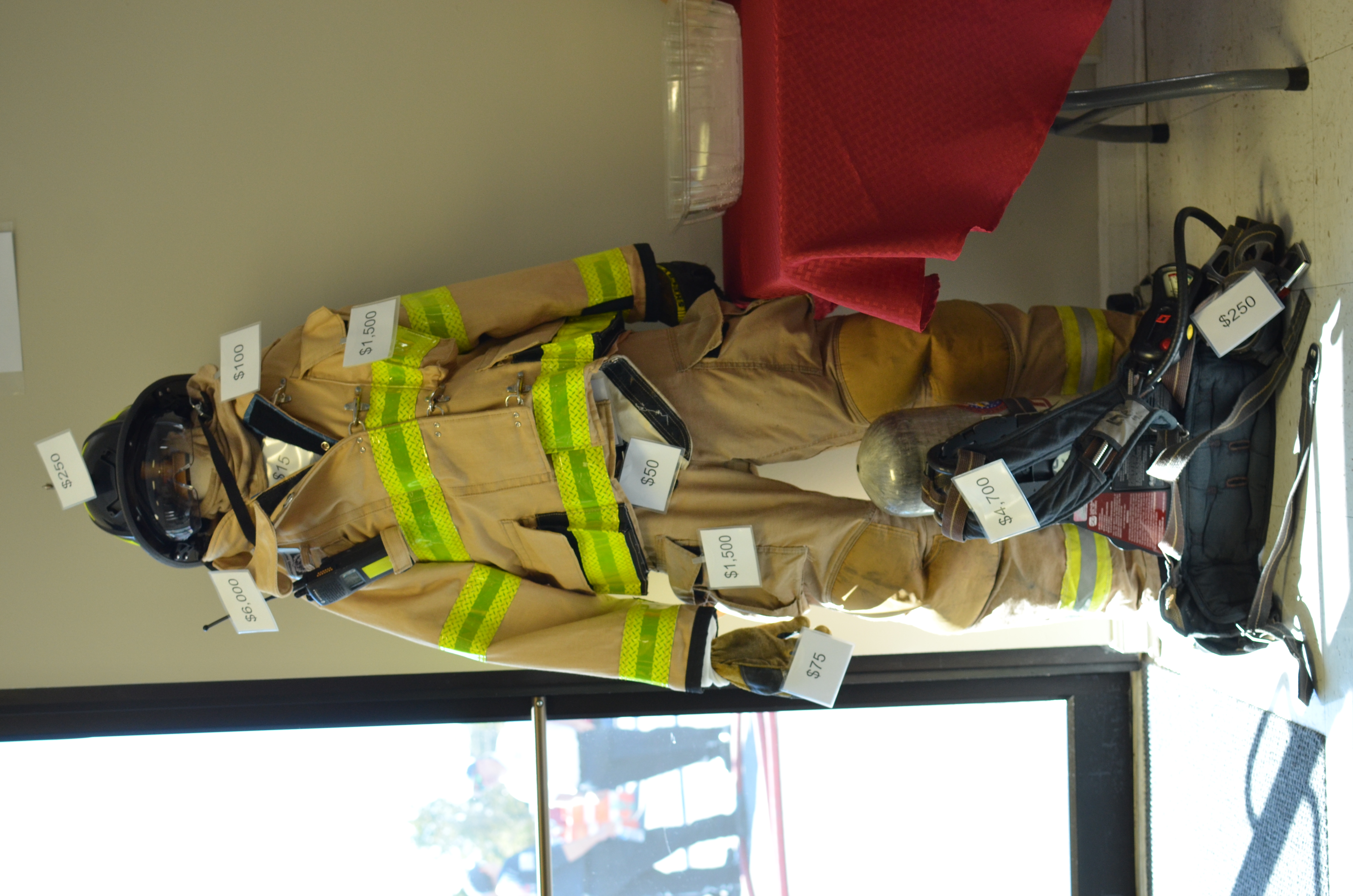 firefighter gear labeled with price tags