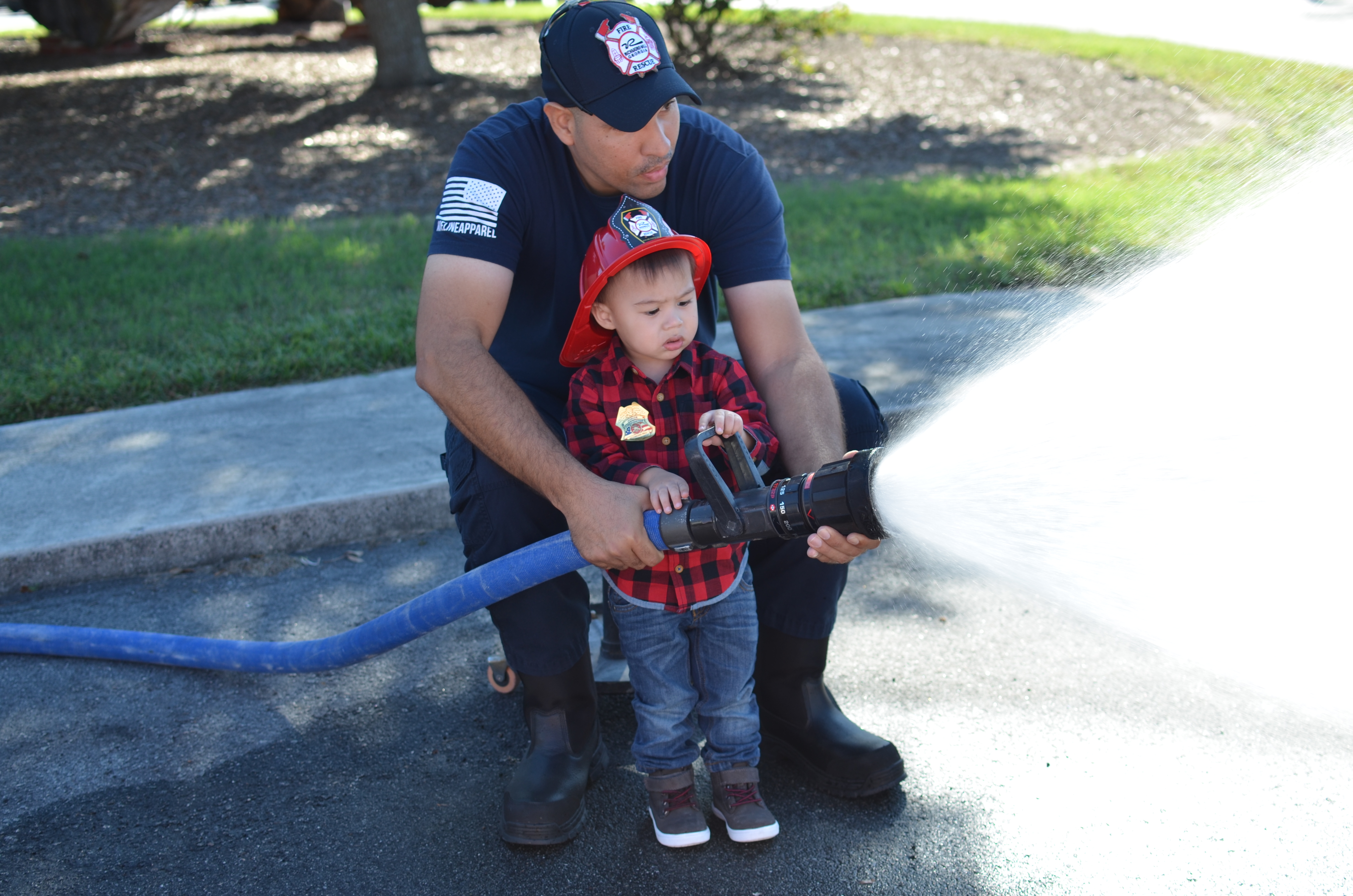 firefighter using fire hose