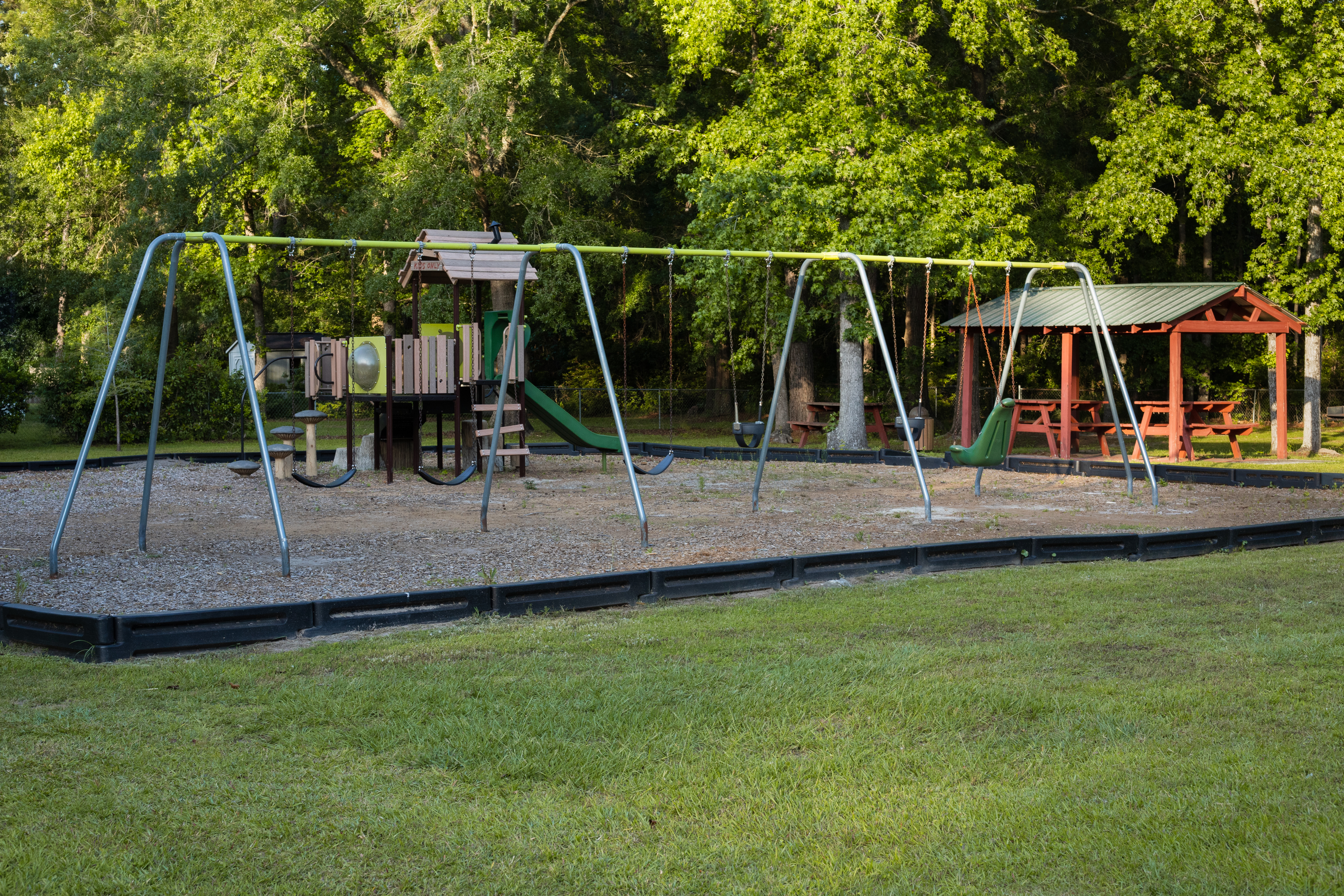 Richmond Heights Park swing set and pavilion