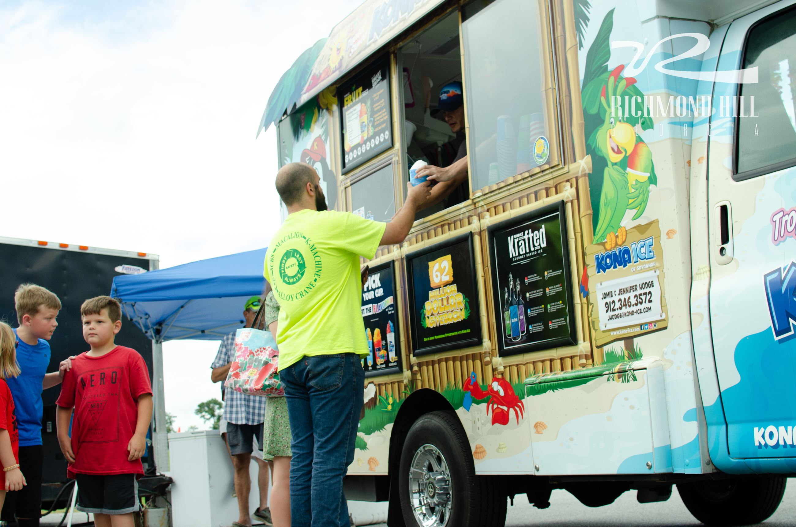 man waits in line at a food truck