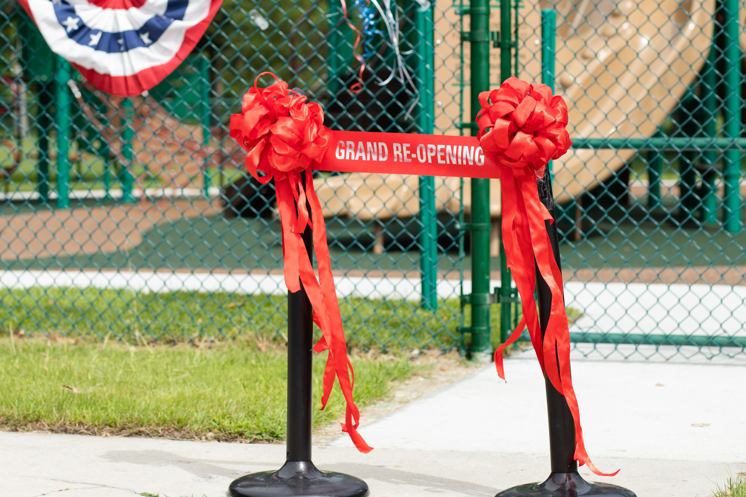 red grand opening ribbon